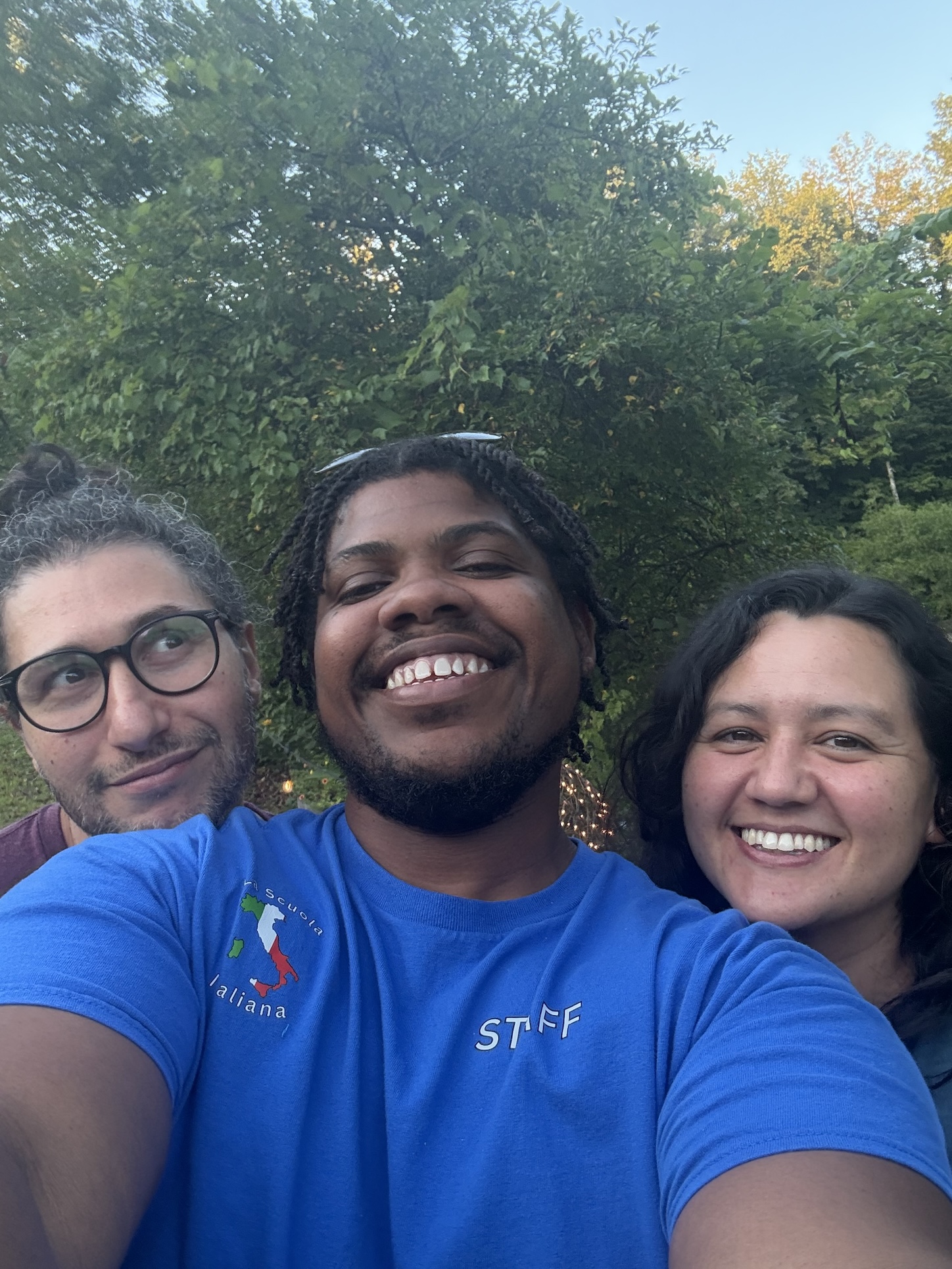 Three friends take a selfie. 