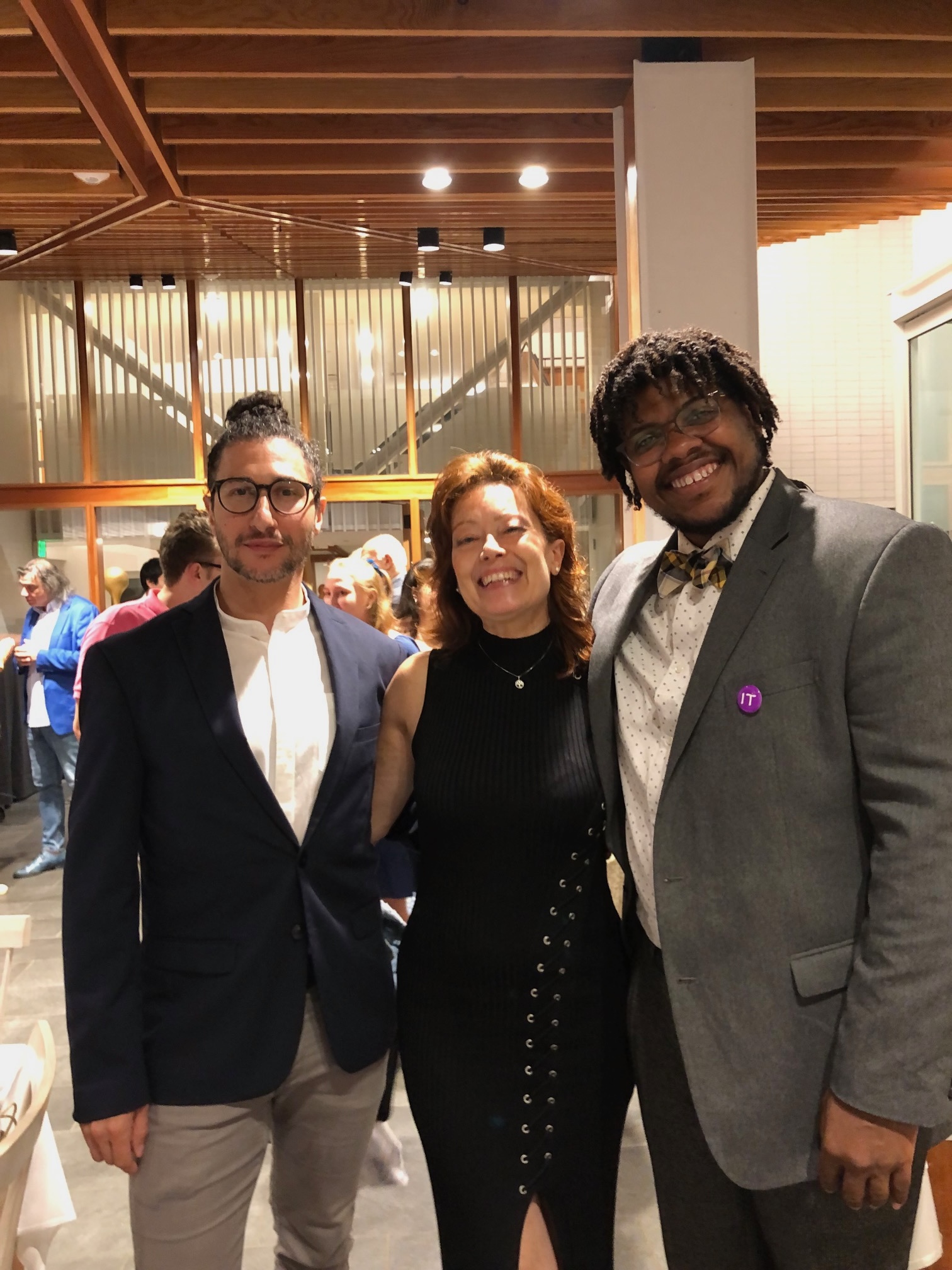 A group of staff members in suits at the Italian School
