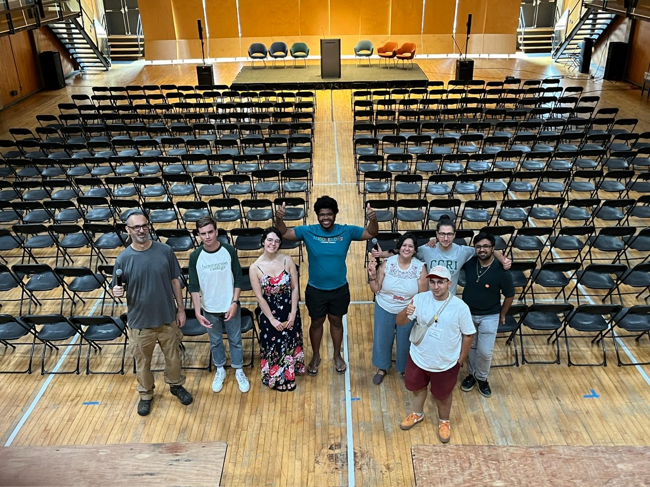 A man with his friends in a concert hall on the Bennington College campus. 