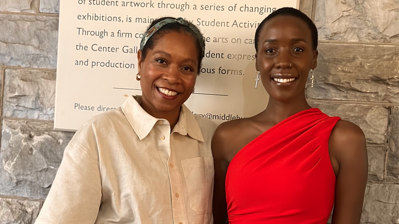 A woman in a red dress and her friend in a white shirt. 