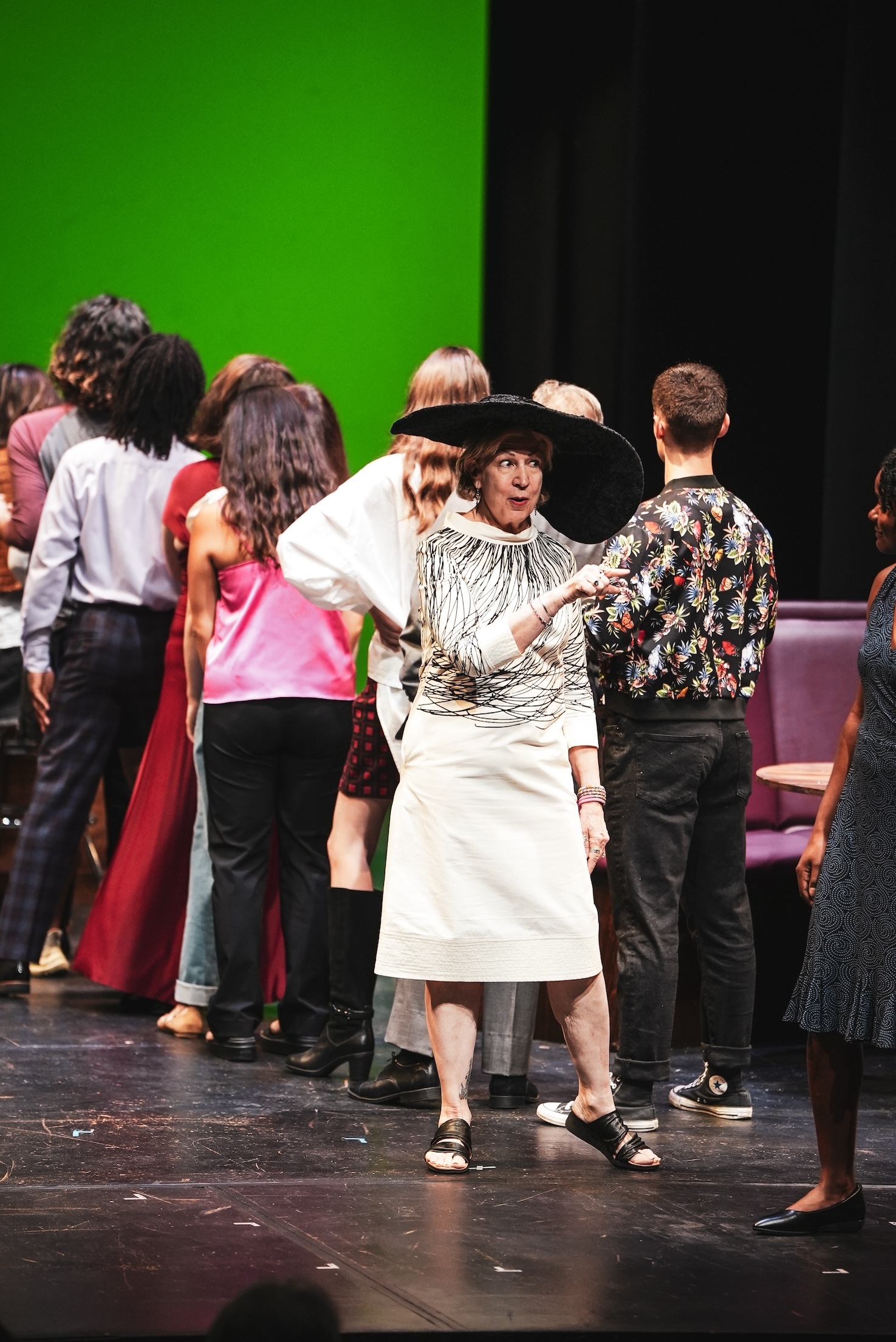 a woman performs in a theater production.