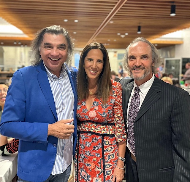 An Italian School student with two Italian School directors. 