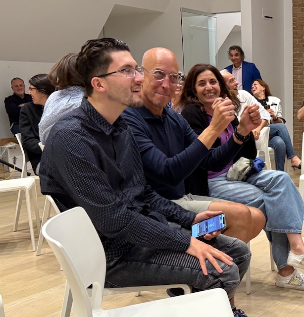 Italian School students and staff attend an event. 