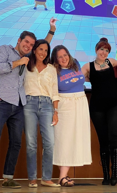 A group of Italian School students play a game on stage. 