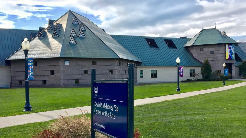 A building with many sunlights on the roof on the Middlebury College campus.