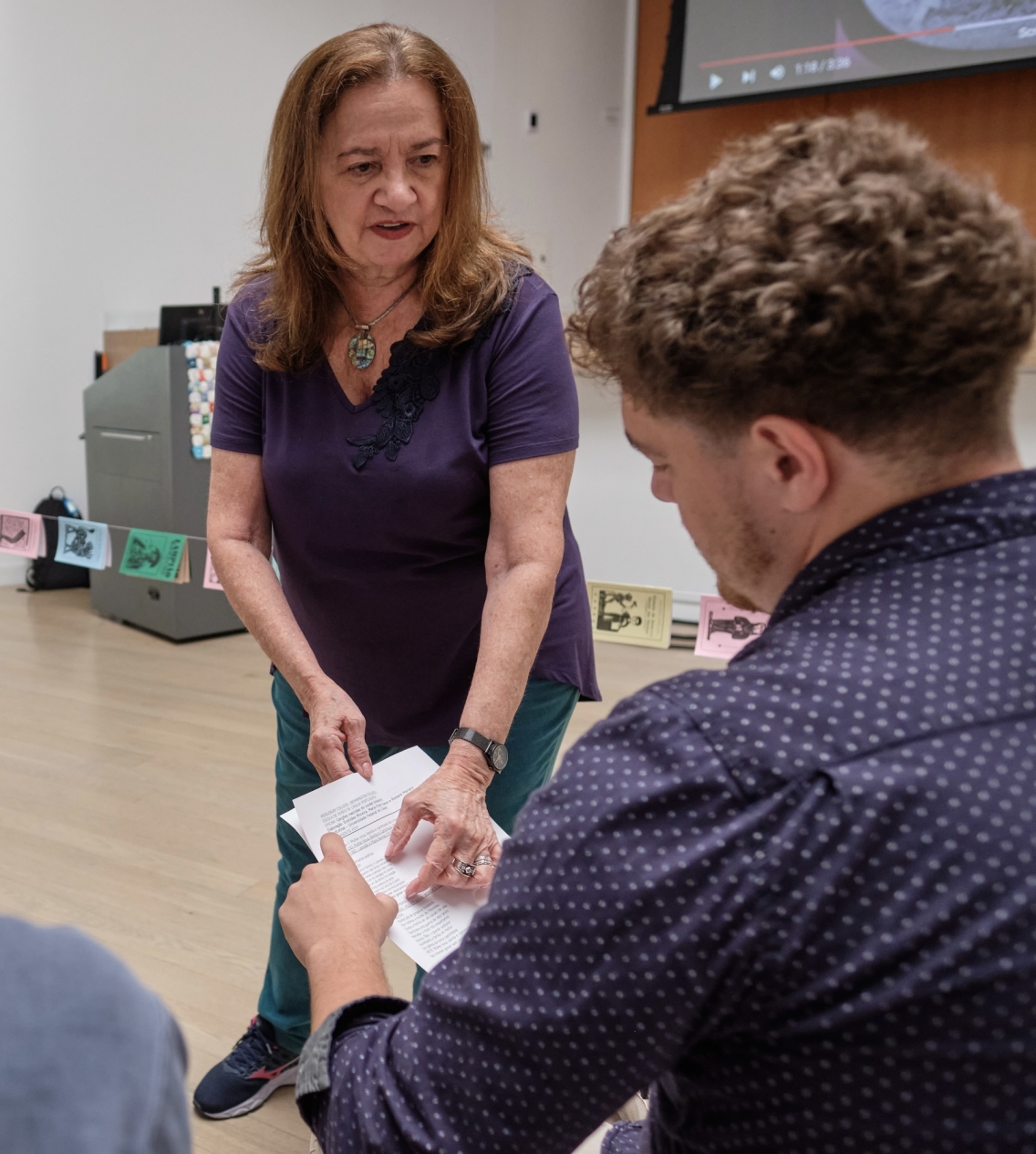 Jack Savage's teacher at the School of Portuguese, pointing out a passage in an article.