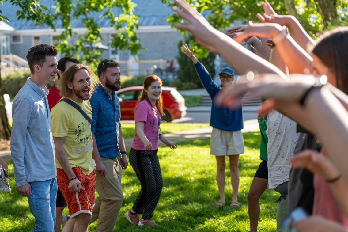 Students and staff at the School of Russian play a bonding game outside.