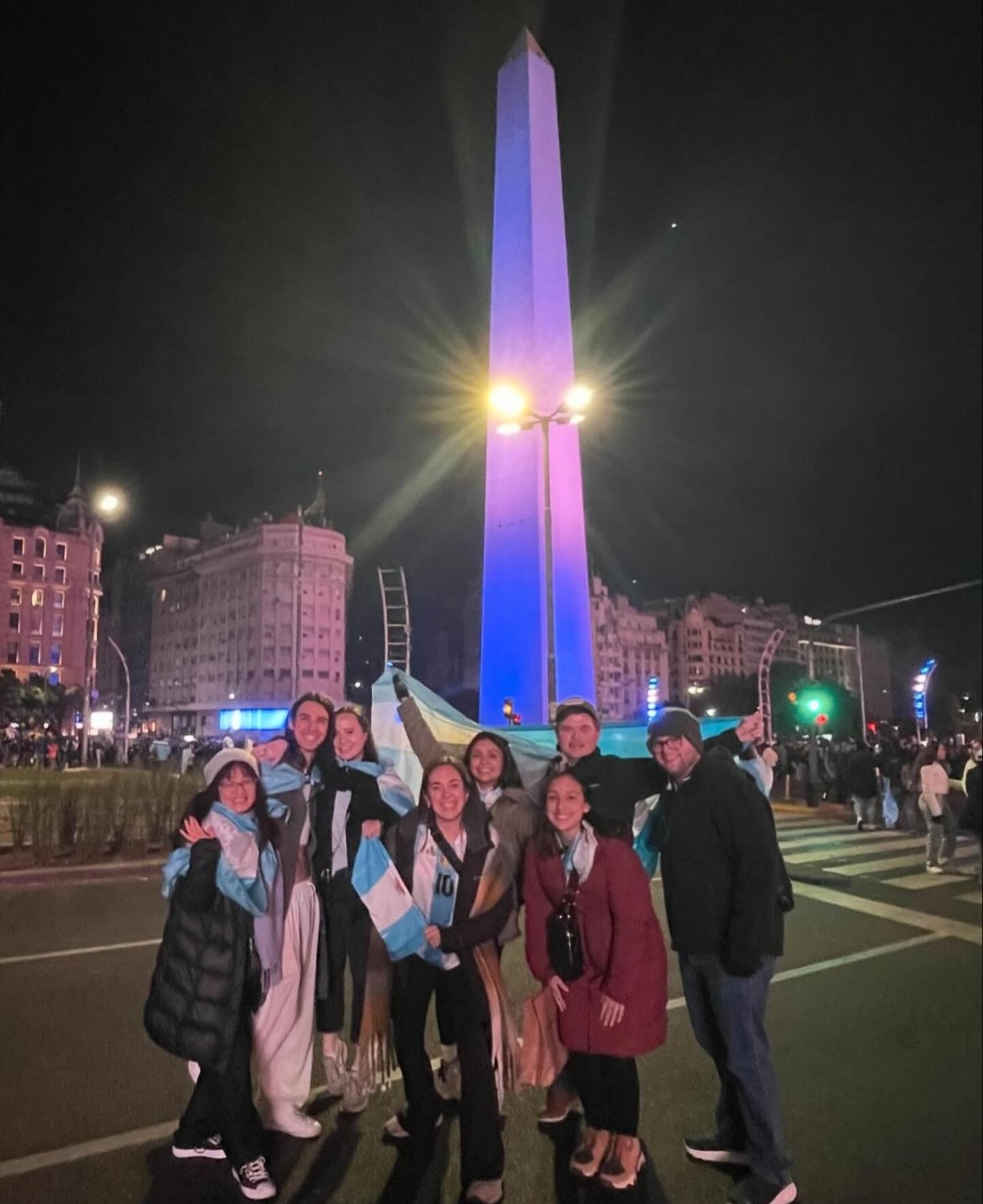 Students celebrate with Argentine gear in front of the downtown Obelisk.