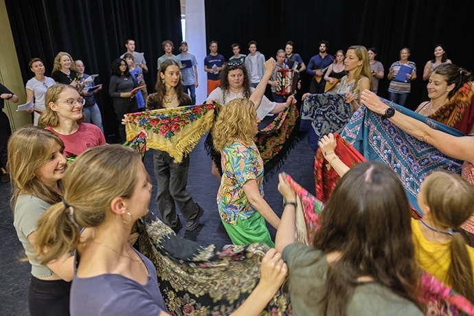 Students and teacher doing Russian dance with handkerchiefs.