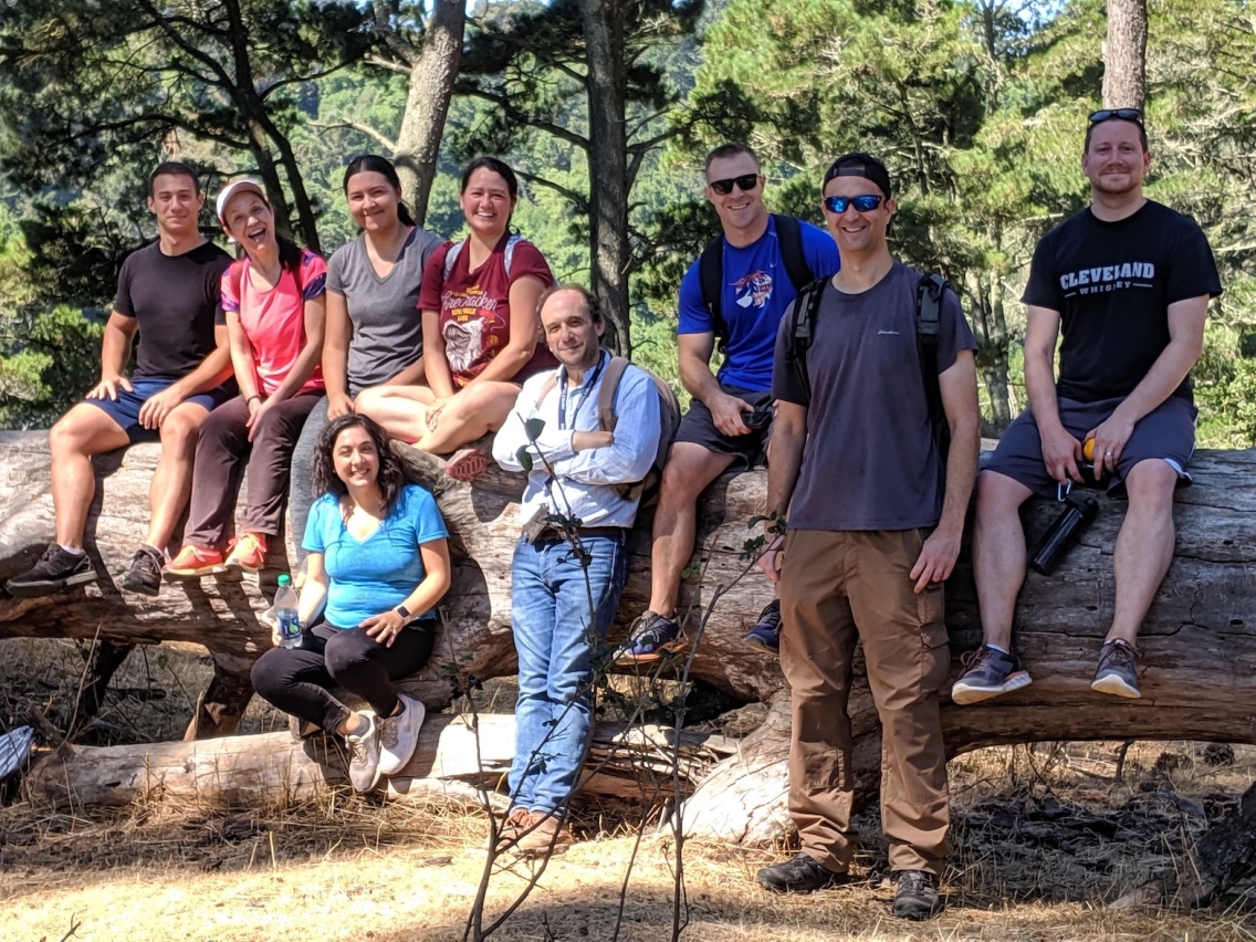A group of students hikes in Oakland Regional Park, 2019.