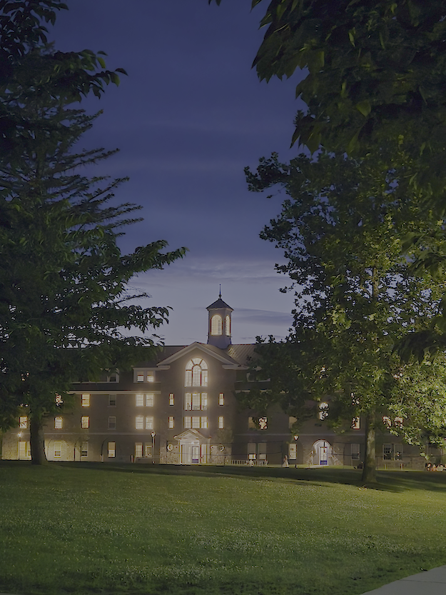 A Middlebury College building illuminated by the moon. 