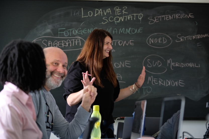 an Italian School classroom with laughing students and teacher. 