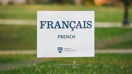 School of French sign with the grass.