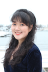 A student smiles at the camera.
