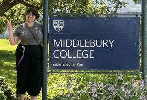 In front of the Midd sign.