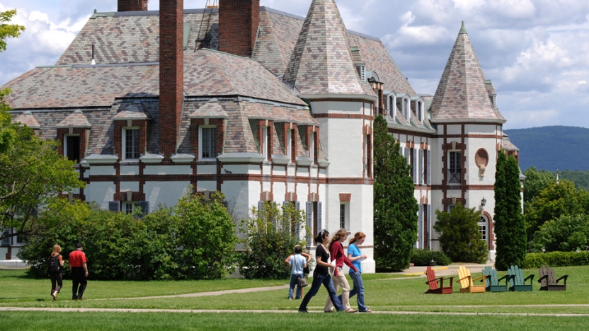 Students walking on campus in front of Le Chateau.