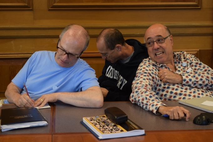 Three male Hebrew Lifelong Learners sitting together in classroom talking.