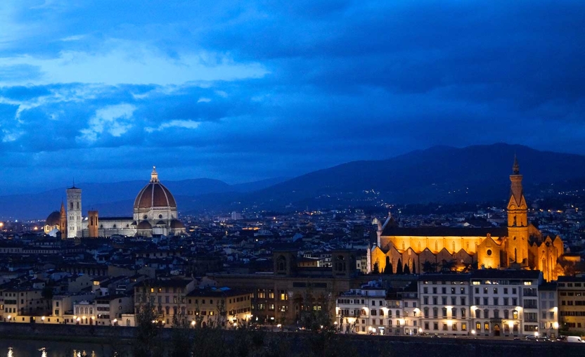 Skyline of Italian city at dusk.