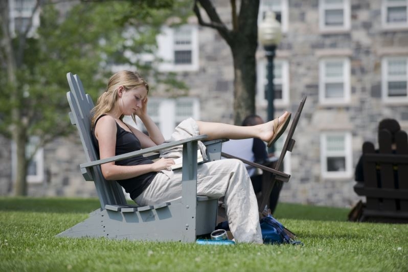 Girl is studing on the Middlebury Campus.