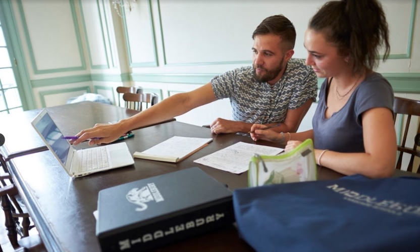 Two students study at Middlebury.