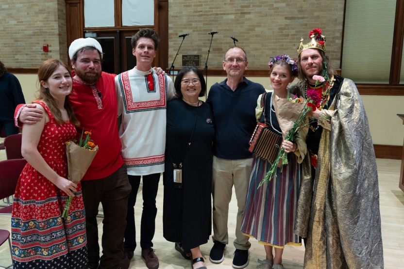 Students and staff pose after a performance. 