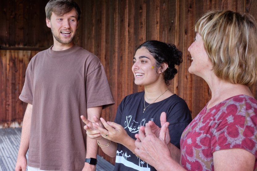 Students present in an outdoor classroom. 
