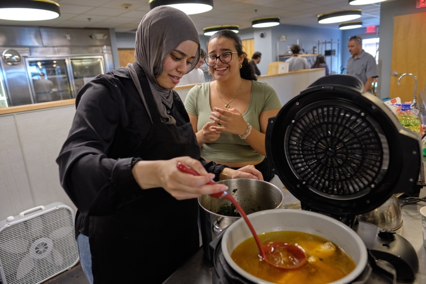 Students use a pressure cooker to cook food. 