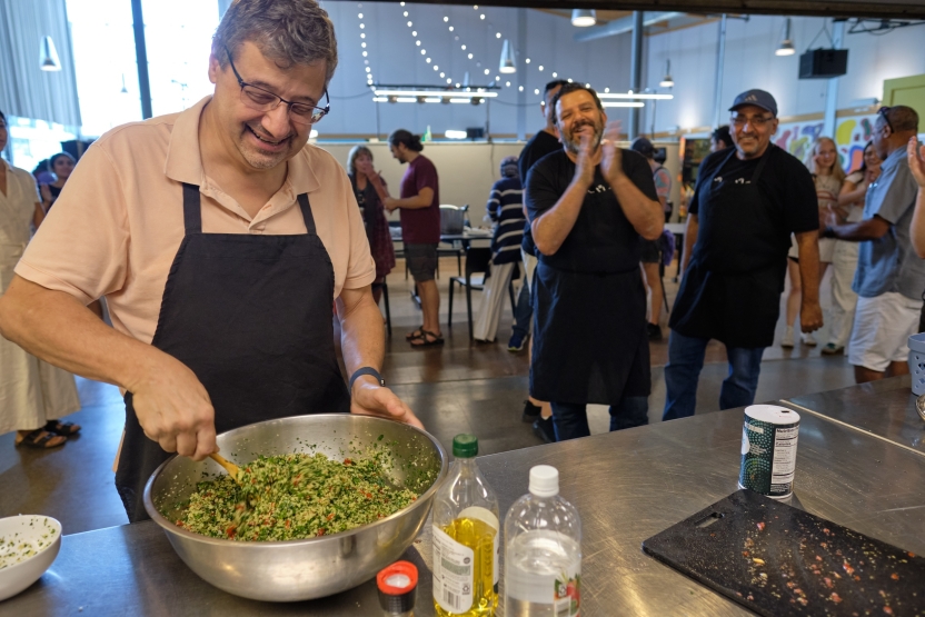 A student cooks at the Arabic School. 
