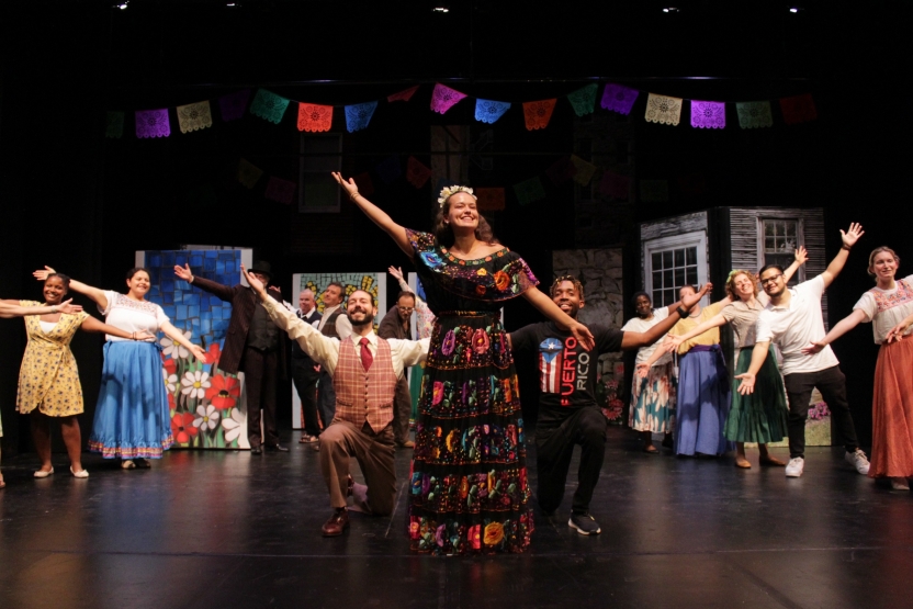 A group performs a play onstage. 