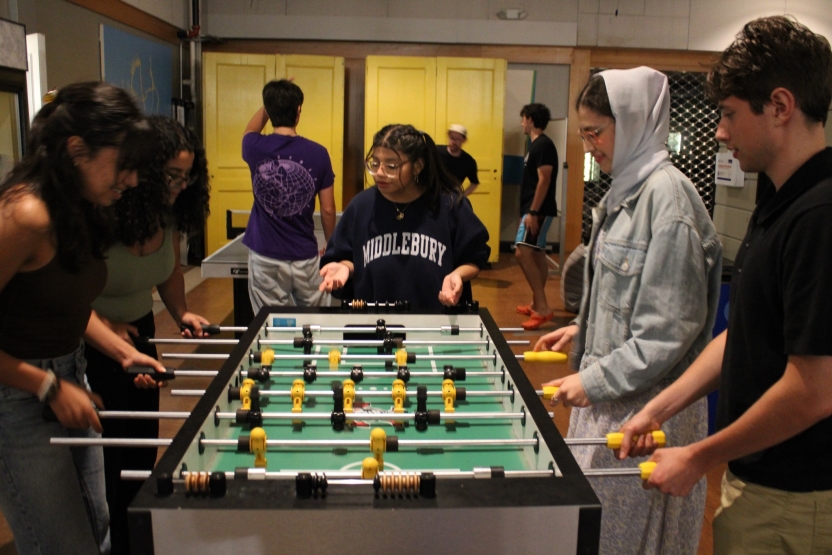Students play Fussball. 