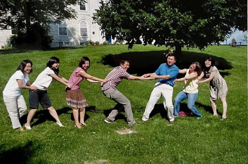 Faculty at the Chinese School play tug of war. 