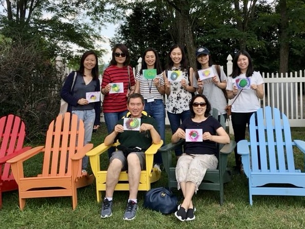 Faculty and students pose with their artwork at the Chinese School at Middlebury College.