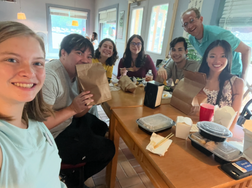 students smile at a Chinese restaurant in the town of Middlebury.