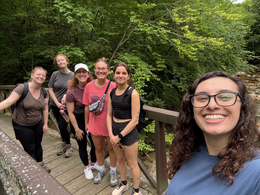 A group of students on a bridge outside. 