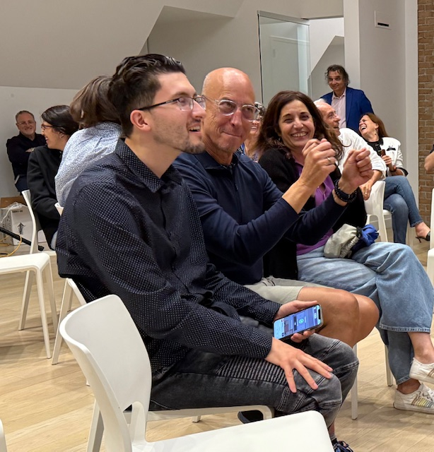 Italian School students and staff attend an event. 