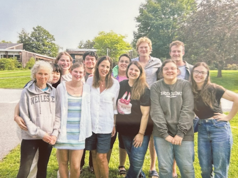 A group of Italian School students smile outside. 