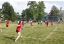 Students participate in a volleyball game on the Middlebury Campus.