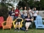 Faculty and students pose with their artwork at the Chinese School at Middlebury College.