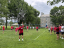 Chinese School students play volleyball outside. 