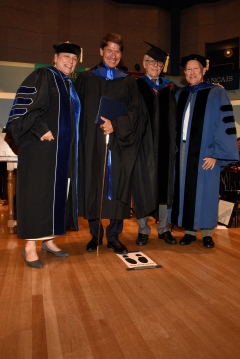 Keynote speaker with the President and Dean.