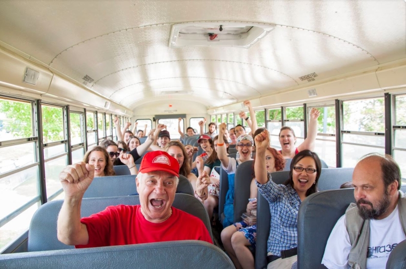 Excited students prepare for a bus trip.