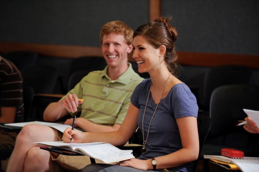 A master's student studies with her friend.