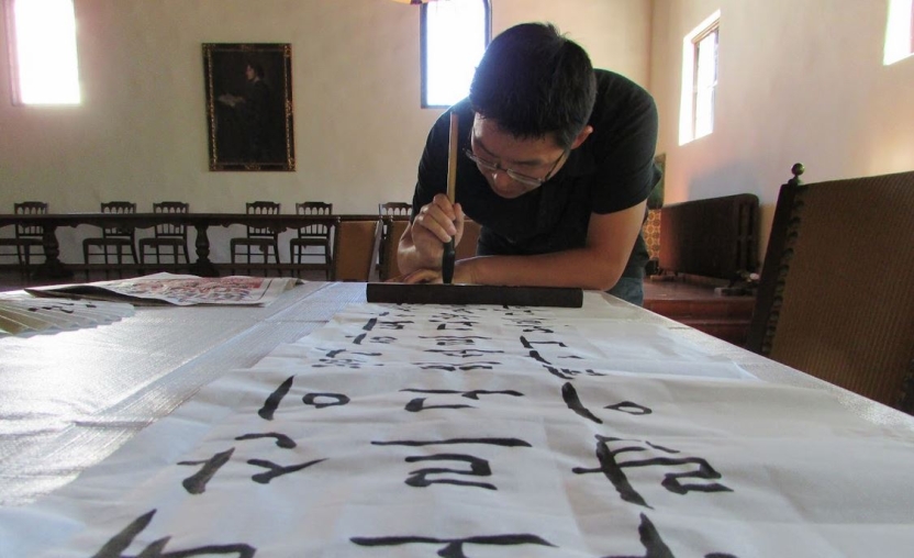 Picture of a student writing Korean.