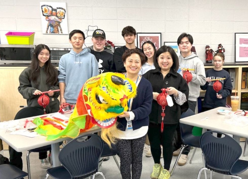 Middlebury Chinese School master’s degree student Fang Bian (front) and her students enjoy a Lantern Festival celebration.