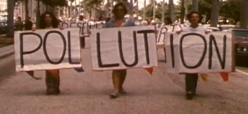 Protestors holding pollution banner