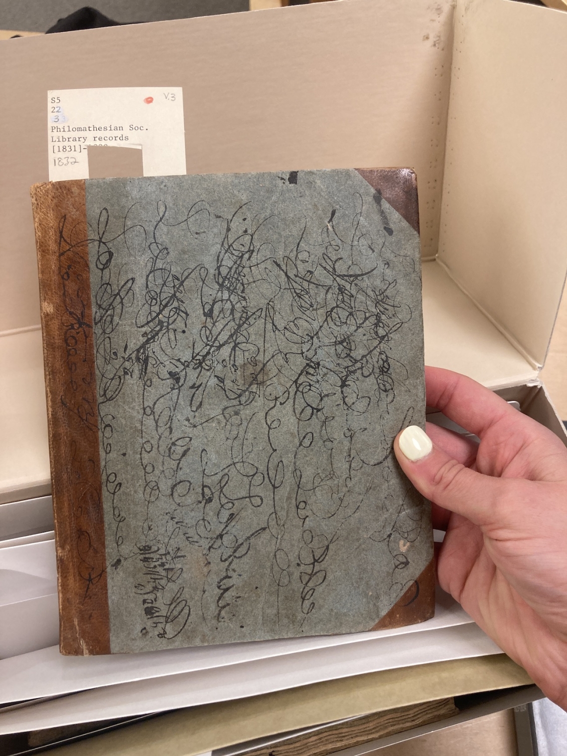 blue journal with black ink squiggles 