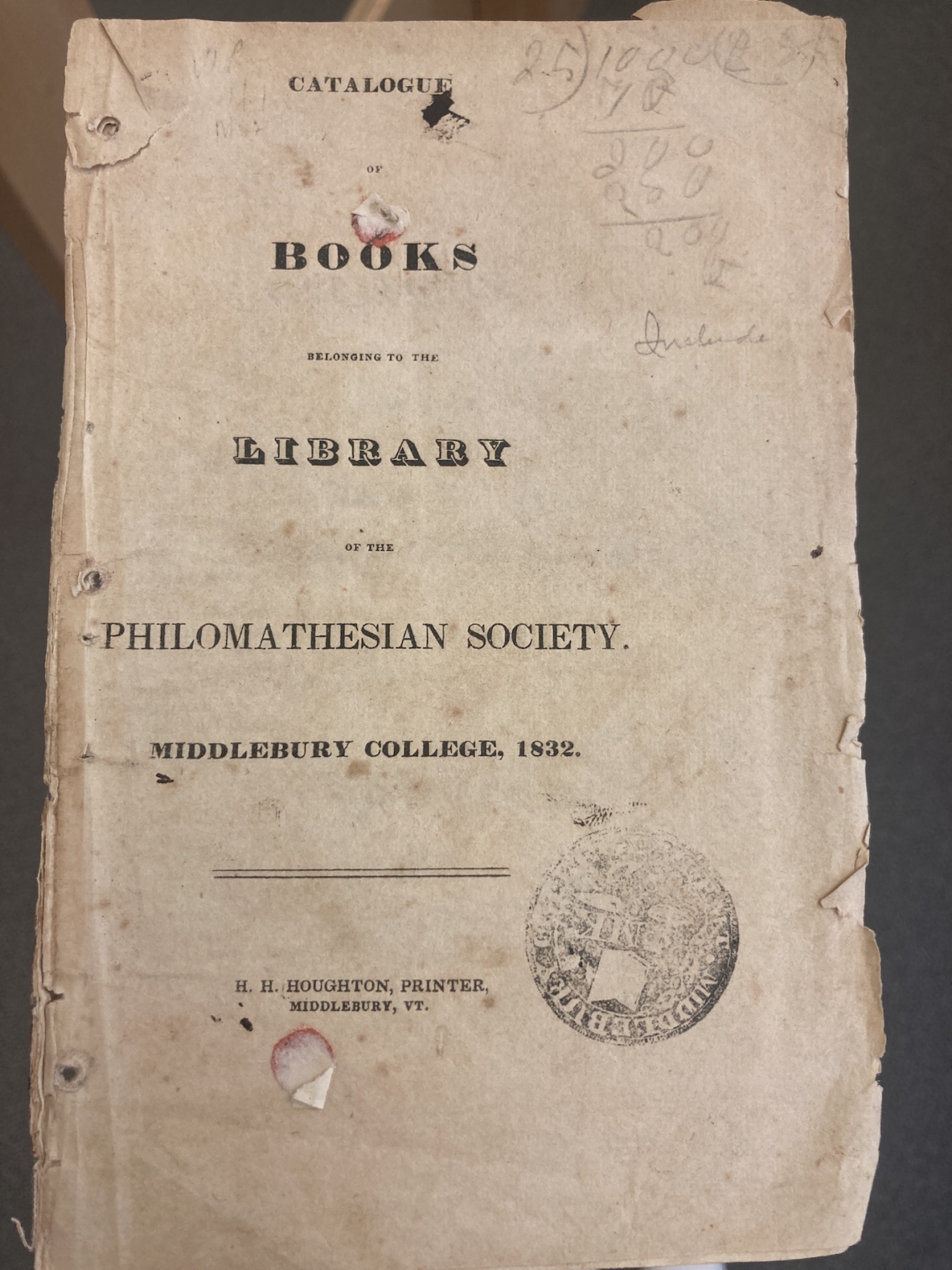 cover of tattered pamphlet listing books in the library of the philomathesian society