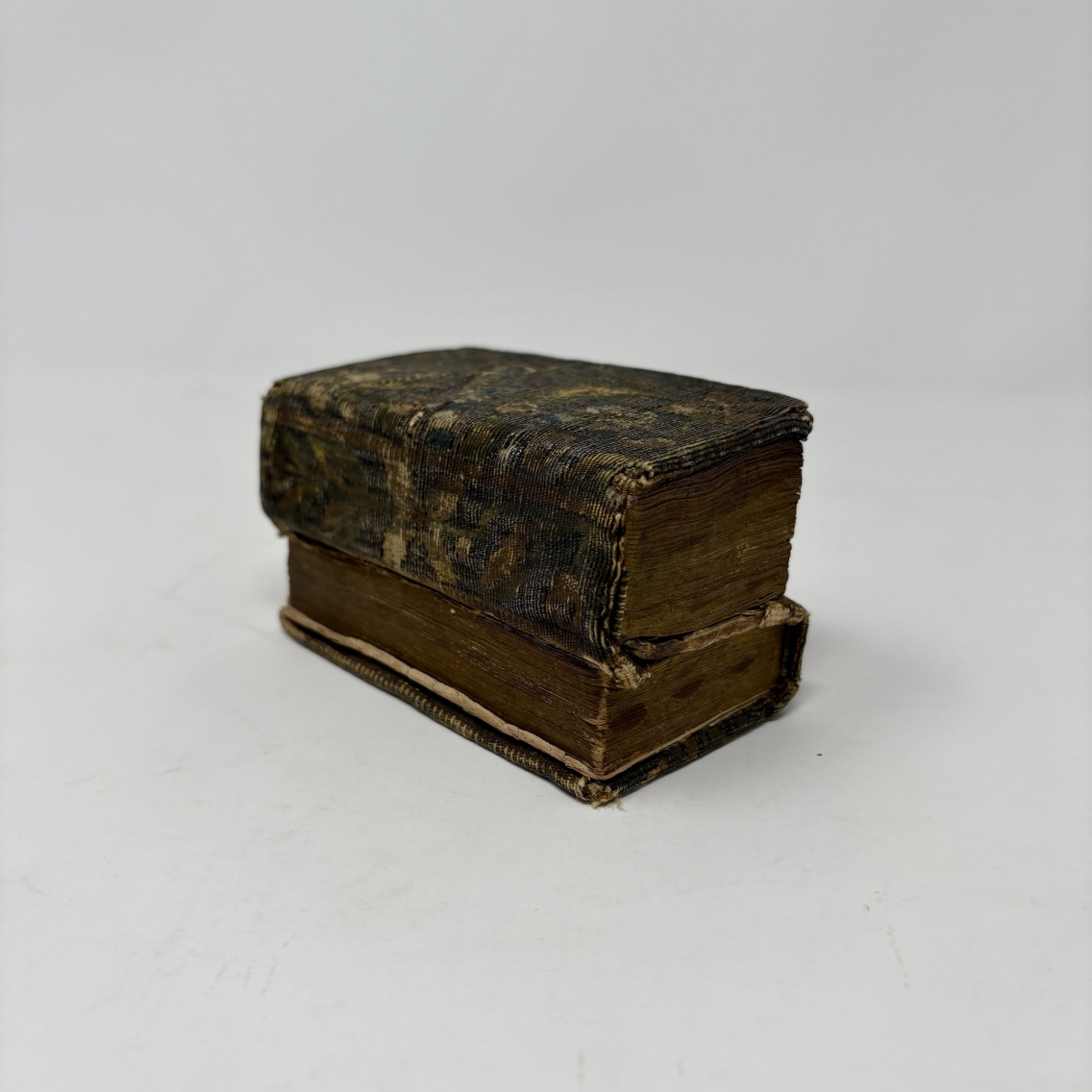dos-a-dos binding book laying flat on a white background
