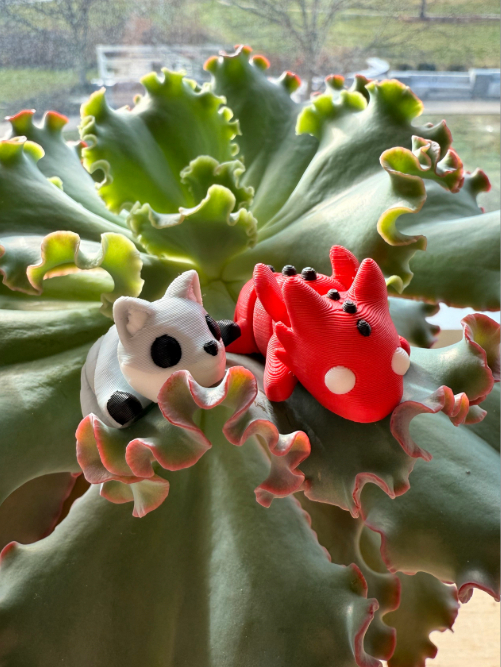 Small 3d printed red dragon and silver fox