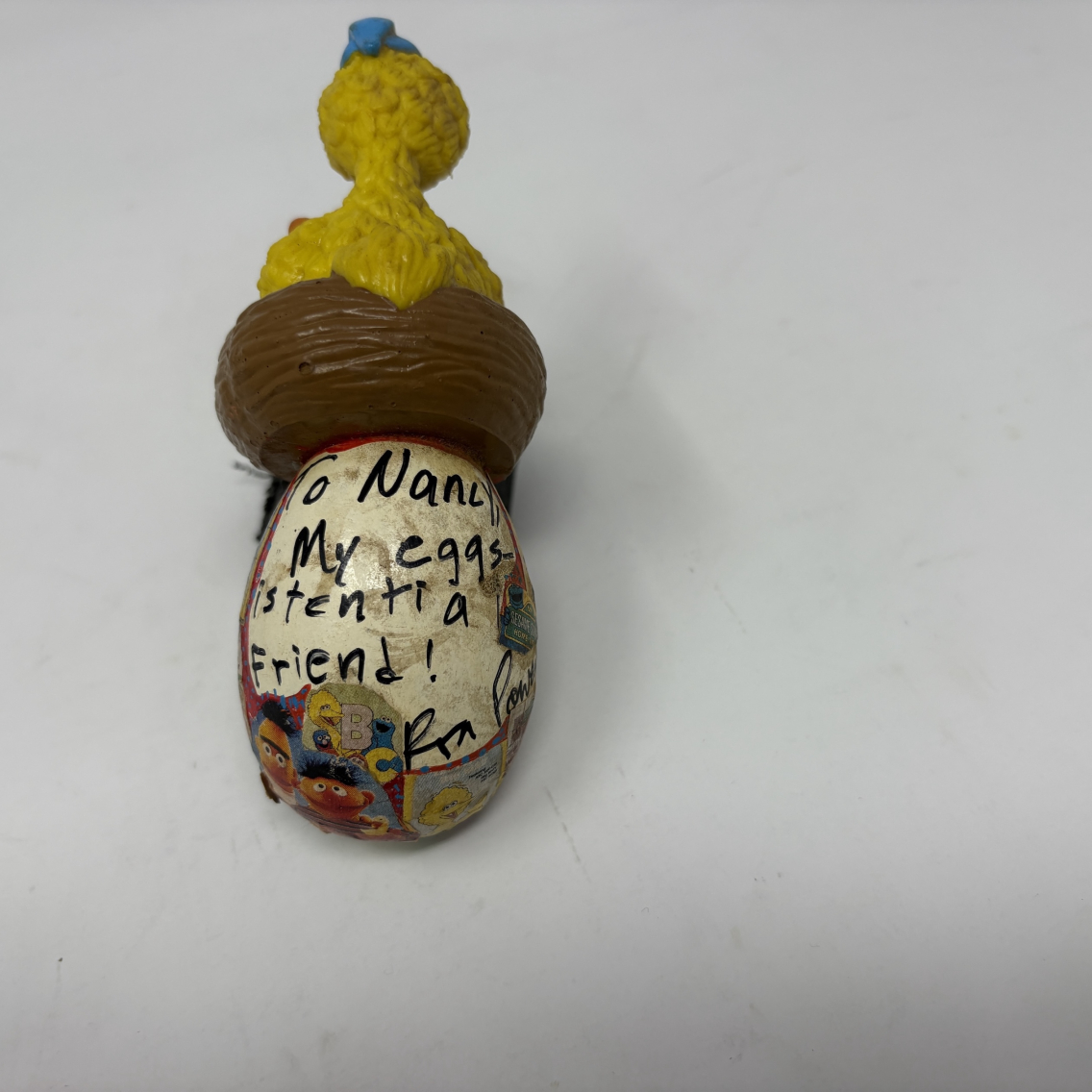 wooden egg signed by ron powers with big bird figurine on top